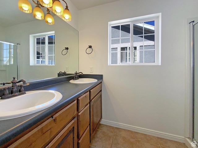 6842 W Grevillea Ln, West Jordan, UT 84081 - bathroom featuring double vanity, a shower stall, tile patterned floors, and a chandelier