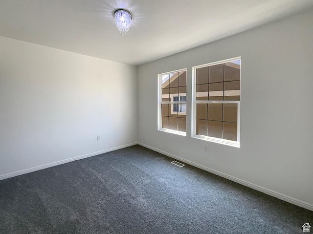 6842 W Grevillea Ln, West Jordan, UT 84081 - empty room with dark carpet and baseboards