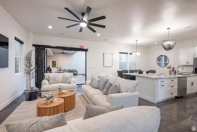 4254 W Cambridge Pkwy, Hurricane, UT 84737 - living room featuring ceiling fan, a chandelier, and recessed lighting