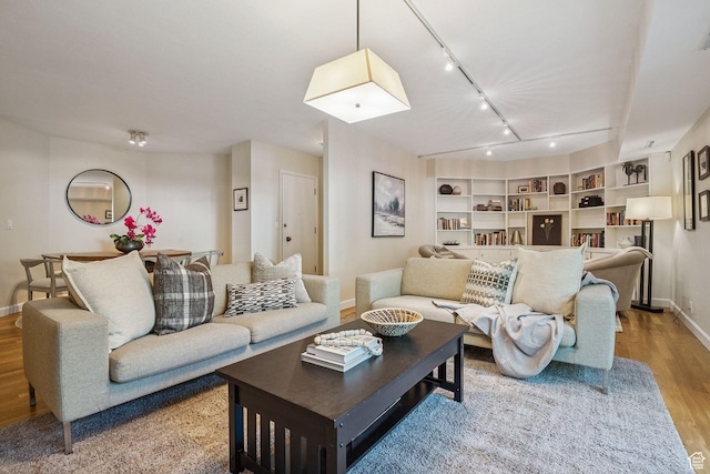 900 S Donner Way E Unit 405, Salt Lake City, UT 84108 - living area with wood finished floors and track lighting
