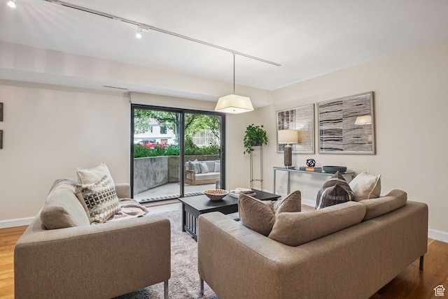900 S Donner Way E Unit 405, Salt Lake City, UT 84108 - living room with rail lighting and light wood-style flooring