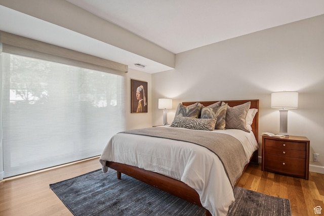900 S Donner Way E Unit 405, Salt Lake City, UT 84108 - bedroom featuring wood finished floors
