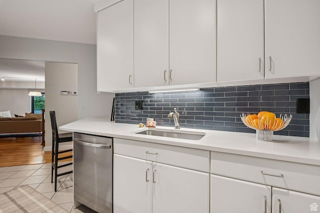 900 S Donner Way E Unit 405, Salt Lake City, UT 84108 - kitchen featuring dishwasher, light countertops, and white cabinets