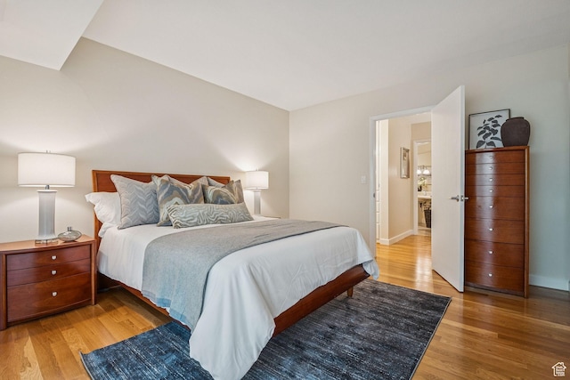 900 S Donner Way E Unit 405, Salt Lake City, UT 84108 - bedroom with light wood-style flooring and baseboards