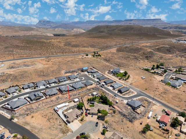1430 W 365 N, Hurricane, UT 84737 - aerial overview of property's location featuring a mountain backdrop and nearby suburban area