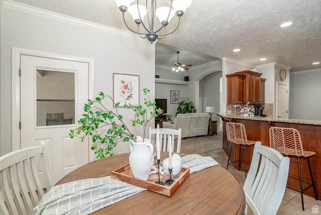 1430 W 365 N, Hurricane, UT 84737 - dining space with ornamental molding, a chandelier, recessed lighting, a ceiling fan, and arched walkways