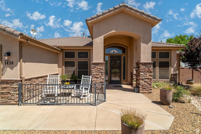 1430 W 365 N, Hurricane, UT 84737 - property entrance with a tiled roof, stone siding, and stucco siding