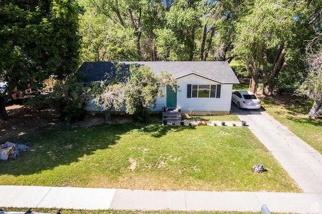 454 W 650 N, Vernal, UT 84078 - bungalow featuring a front lawn, asphalt driveway, and roof with shingles
