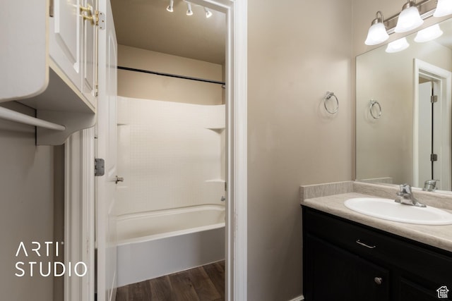1789 N Aaron Dr E, Tooele, UT 84074 - bathroom with vanity, wood finished floors, and shower / washtub combination