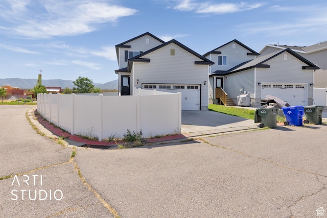 1789 N Aaron Dr E, Tooele, UT 84074 - traditional-style house with a mountain view and driveway
