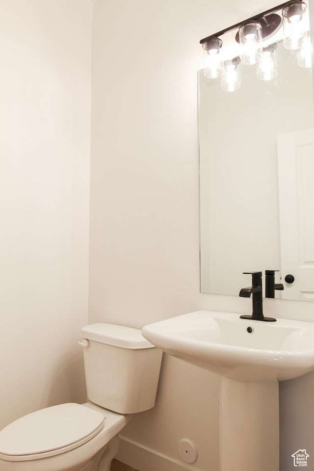 229 W 690 N, Smithfield, UT 84335 - half bath featuring toilet and baseboards