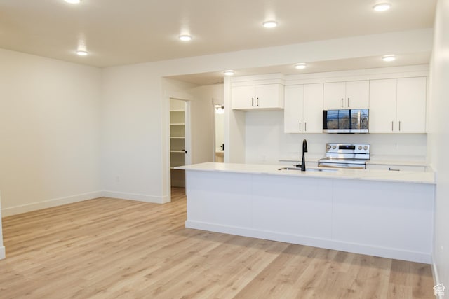 229 W 690 N, Smithfield, UT 84335 - kitchen with appliances with stainless steel finishes, light countertops, light wood-type flooring, and recessed lighting