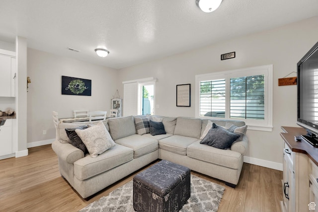 382 E 1850 N Unit 5, North Ogden, UT 84414 - living area featuring light wood finished floors and baseboards