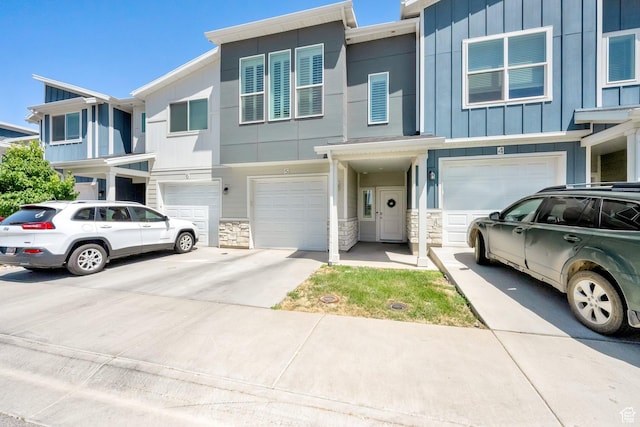 382 E 1850 N Unit 5, North Ogden, UT 84414 - multi unit property with a garage, driveway, board and batten siding, and stone siding