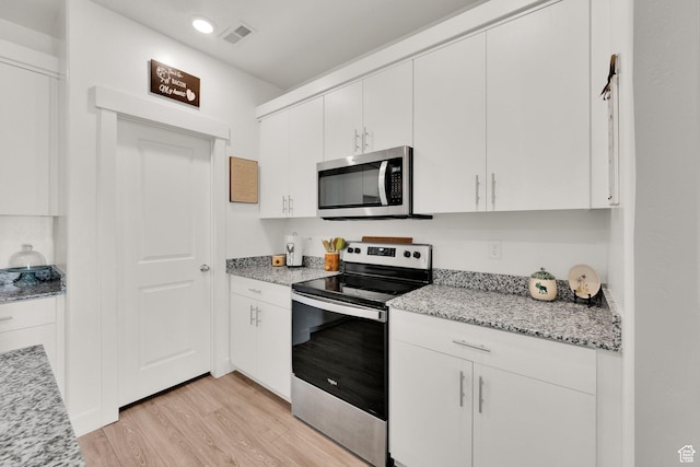 382 E 1850 N Unit 5, North Ogden, UT 84414 - kitchen featuring appliances with stainless steel finishes, light wood-style floors, white cabinets, recessed lighting, and light stone counters