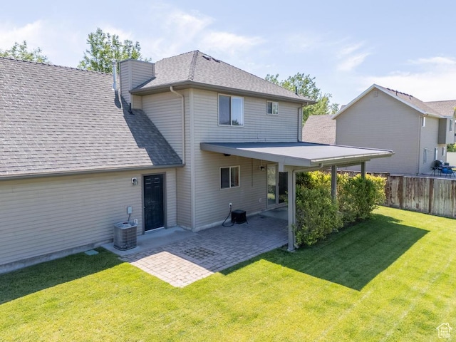 1033 S Southgate Ct W, Logan, UT 84321 - back of house with roof with shingles, a patio area, and a chimney
