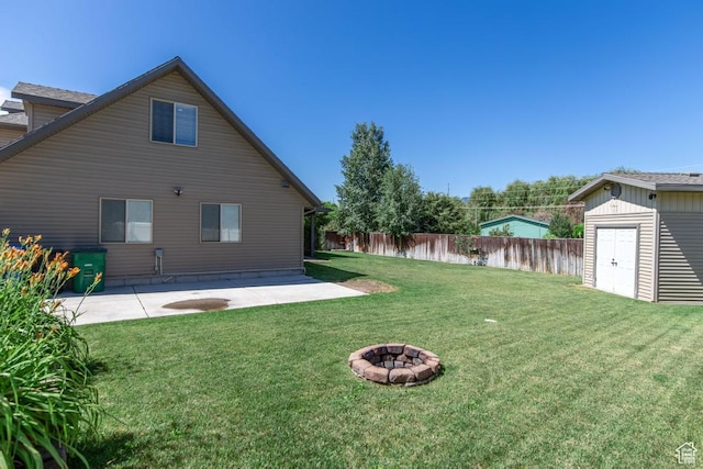 1033 S Southgate Ct W, Logan, UT 84321 - view of yard featuring a patio, a storage unit, and a fire pit