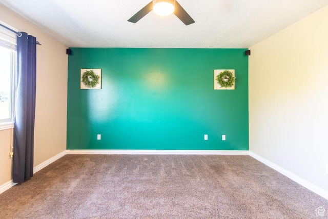1033 S Southgate Ct W, Logan, UT 84321 - carpeted empty room with ceiling fan and baseboards
