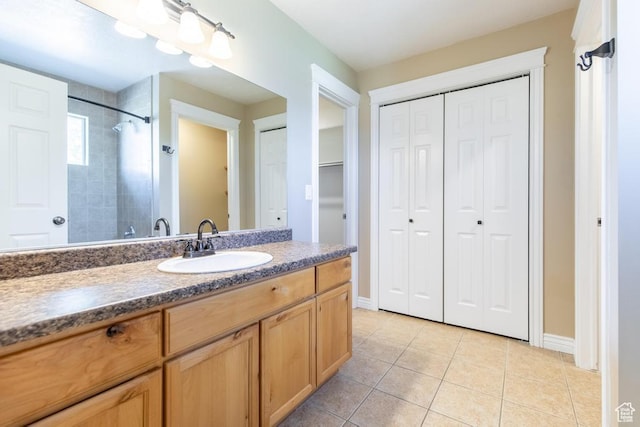 1033 S Southgate Ct W, Logan, UT 84321 - bathroom with a closet, vanity, tile patterned flooring, and tiled shower