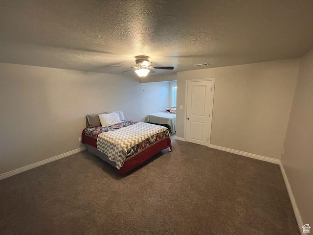 2433 N 1445 W, Clinton, UT 84015 - bedroom featuring dark carpet, a textured ceiling, and ceiling fan
