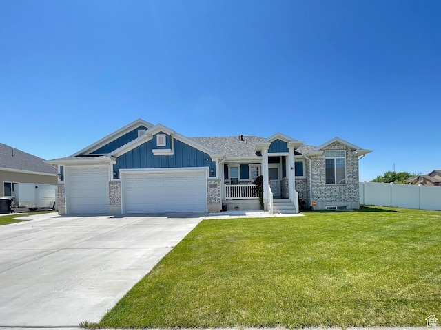 2433 N 1445 W, Clinton, UT 84015 - single story home featuring an attached garage, board and batten siding, concrete driveway, and brick siding