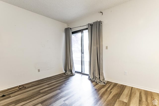 245 N Vine St Unit 205, Salt Lake City, UT 84103 - empty room featuring wood finished floors and a textured ceiling
