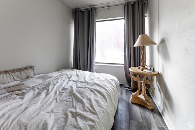245 N Vine St Unit 205, Salt Lake City, UT 84103 - bedroom with wood finished floors and a textured ceiling