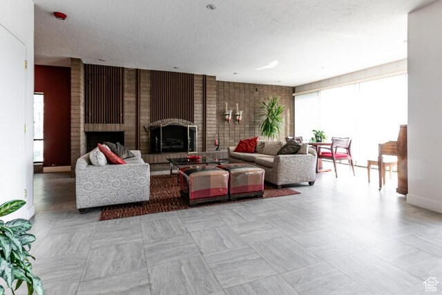 245 N Vine St Unit 205, Salt Lake City, UT 84103 - living room with healthy amount of natural light and a brick fireplace