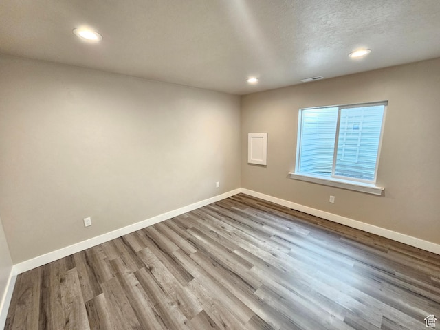 3538 N Willy Way Unit 167, Eagle Mountain, UT 84005 - spare room with recessed lighting, wood finished floors, and a textured ceiling