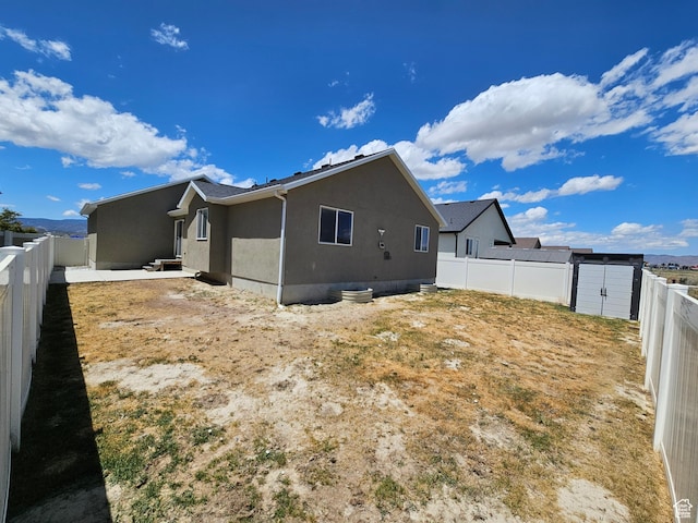 3538 N Willy Way Unit 167, Eagle Mountain, UT 84005 - back of property with a fenced backyard and stucco siding