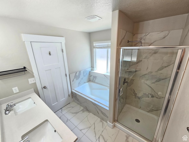 3538 N Willy Way Unit 167, Eagle Mountain, UT 84005 - full bathroom with marble finish flooring, a bath, a marble finish shower, a textured ceiling, and double vanity