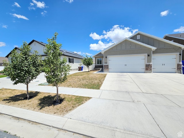 3538 N Willy Way Unit 167, Eagle Mountain, UT 84005 - view of front of home featuring board and batten siding, a garage, and driveway