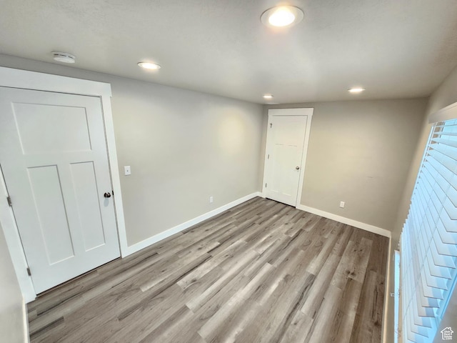 3538 N Willy Way Unit 167, Eagle Mountain, UT 84005 - empty room featuring a smoke detector, light wood-type flooring, and recessed lighting
