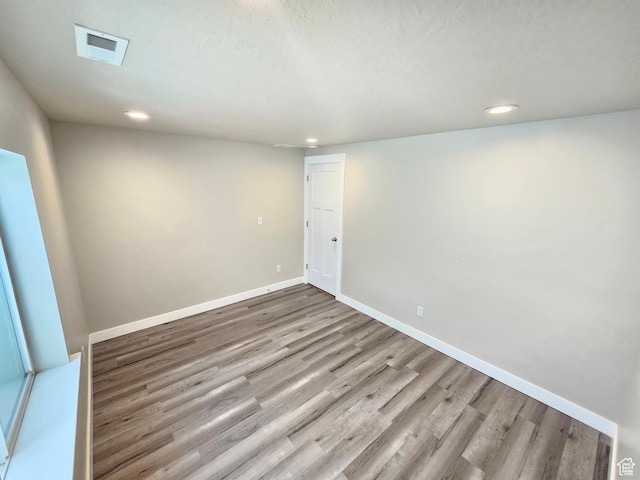 3538 N Willy Way Unit 167, Eagle Mountain, UT 84005 - spare room with wood finished floors and recessed lighting