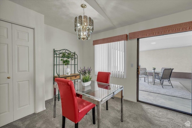 1331 N Dixie Downs Rd Unit 56, St George, UT 84770 - carpeted dining space with a chandelier and baseboards