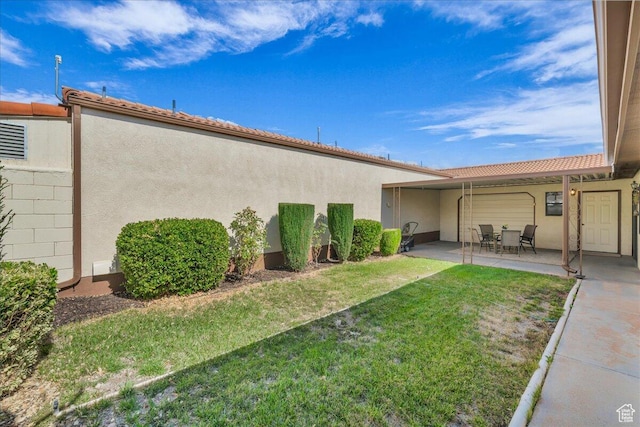 1331 N Dixie Downs Rd Unit 56, St George, UT 84770 - view of green lawn with a patio