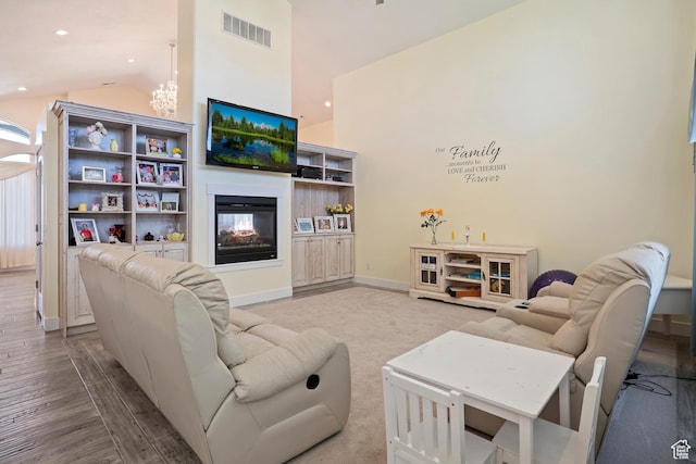 4925 W 3500 S, West Haven, UT 84401 - living room with wood finished floors, recessed lighting, a chandelier, high vaulted ceiling, and a multi sided fireplace