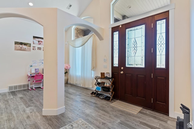 4925 W 3500 S, West Haven, UT 84401 - foyer entrance featuring wood finished floors, a towering ceiling, and arched walkways