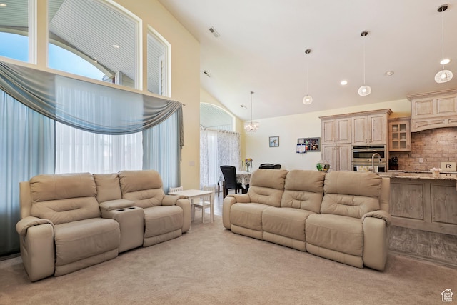 4925 W 3500 S, West Haven, UT 84401 - living room featuring high vaulted ceiling, light colored carpet, and a chandelier