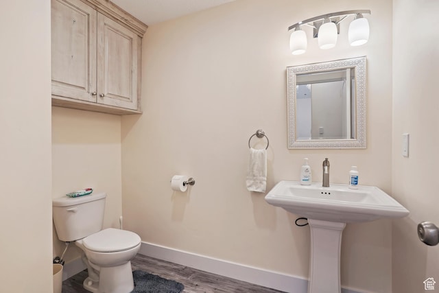 4925 W 3500 S, West Haven, UT 84401 - half bathroom featuring toilet and wood finished floors