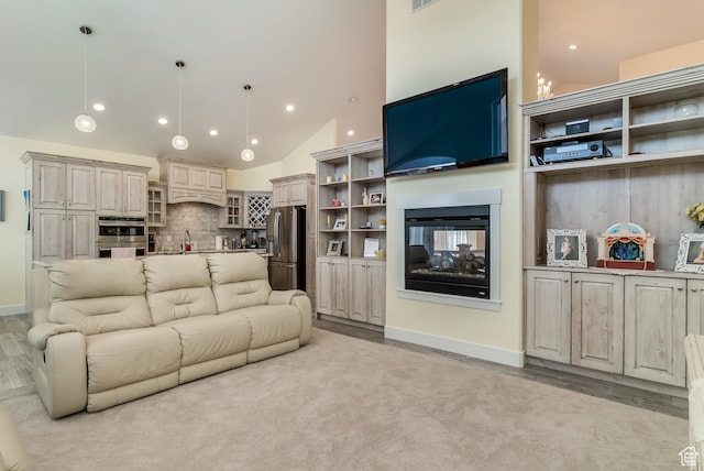 4925 W 3500 S, West Haven, UT 84401 - living room featuring recessed lighting, a multi sided fireplace, light wood-style floors, and high vaulted ceiling