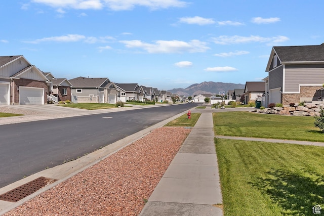 4925 W 3500 S, West Haven, UT 84401 - view of asphalt street featuring a residential view, sidewalks, and a mountain view