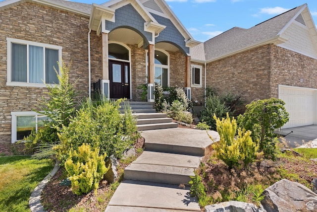 4925 W 3500 S, West Haven, UT 84401 - doorway to property with stone siding, an attached garage, and roof with shingles