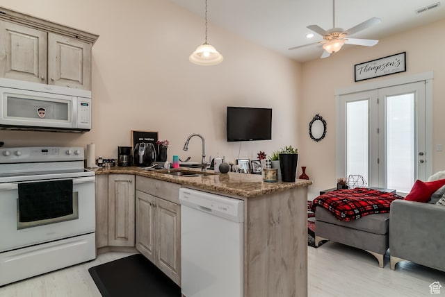4925 W 3500 S, West Haven, UT 84401 - kitchen with white appliances, a peninsula, ceiling fan, light wood-type flooring, and pendant lighting