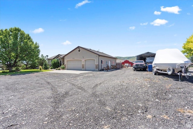7217 W Mccuiston Ave S, Herriman, UT 84096 - view of front of house with an attached garage and driveway