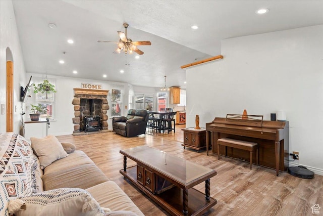 7217 W Mccuiston Ave S, Herriman, UT 84096 - living area featuring ceiling fan, arched walkways, recessed lighting, lofted ceiling, and light wood-type flooring