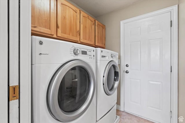 7217 W Mccuiston Ave S, Herriman, UT 84096 - laundry room with independent washer and dryer, cabinet space, and light tile patterned floors