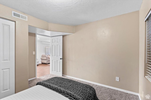 7217 W Mccuiston Ave S, Herriman, UT 84096 - carpeted bedroom featuring baseboards and a textured ceiling