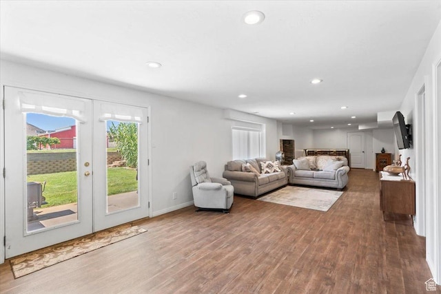 7217 W Mccuiston Ave S, Herriman, UT 84096 - living room with wood finished floors, french doors, and recessed lighting