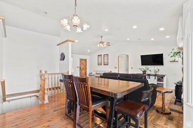 7217 W Mccuiston Ave S, Herriman, UT 84096 - dining space featuring lofted ceiling, arched walkways, recessed lighting, light wood finished floors, and a ceiling fan